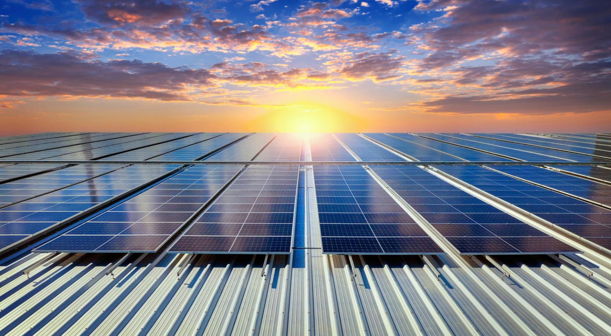 Solar panels on a rooftop at sunset